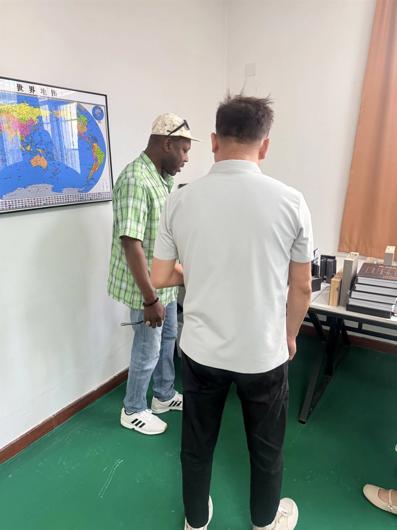 Australian customer and SGL team discussing house window and door drawings during a factory visit Australian customer and SGL team discussing house window and door drawings during a factory visit